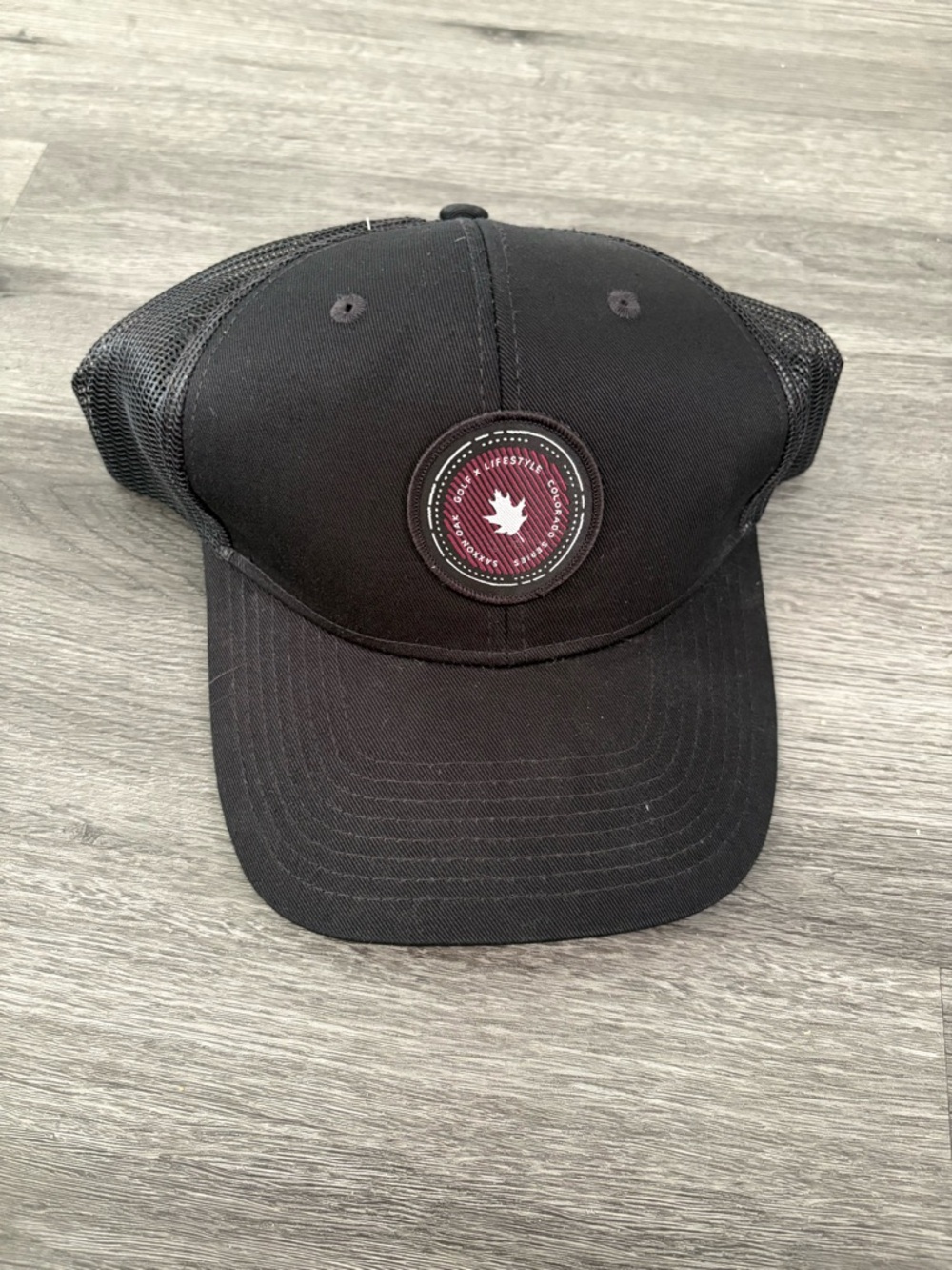 Saxx Black Trucker Hat with Maroon Patch